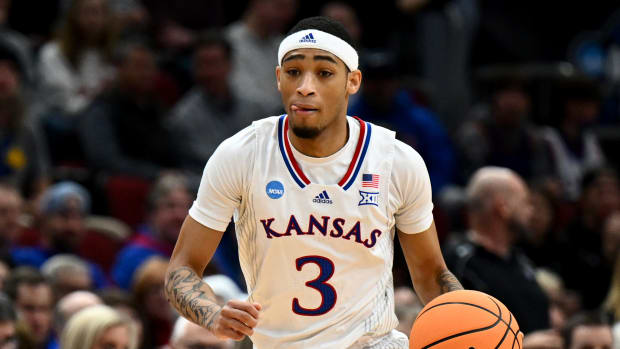 Mar 27, 2022; Chicago, IL, USA; Kansas Jayhawks guard Dajuan Harris Jr. (3) brings the ball up court during the first half against the Miami Hurricanes in the finals of the Midwest regional of the men's college basketball NCAA Tournament at United Center. Mandatory Credit: Jamie Sabau-USA TODAY Sports